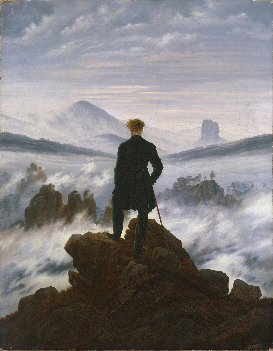 Pintura romántica de un hombre de espaldas, sobre una roca, mirando un mar de niebla entre montañas.